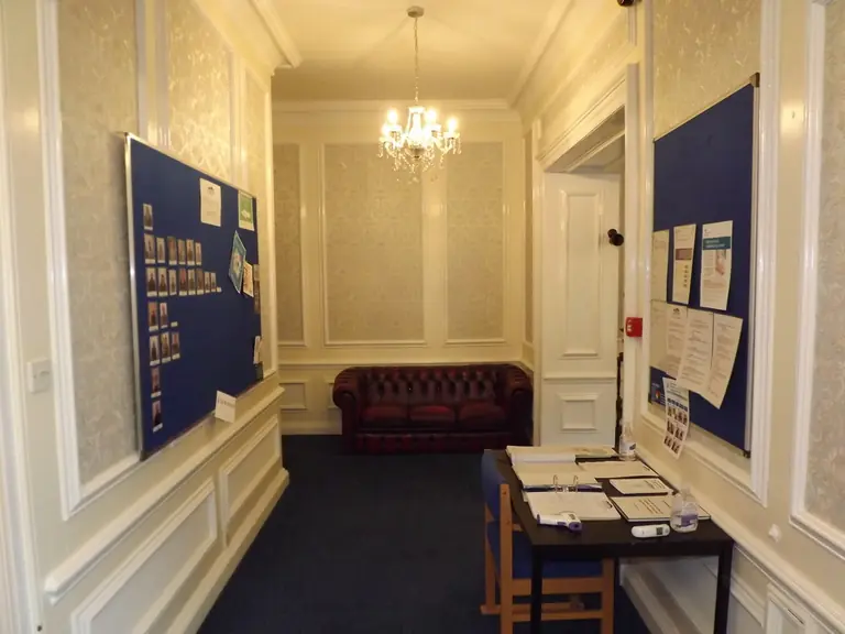 A hallway and information area inside Lakenham